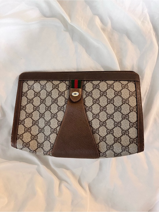 Gucci Handbags - Gucci Brown GG Supreme Canvas clutch